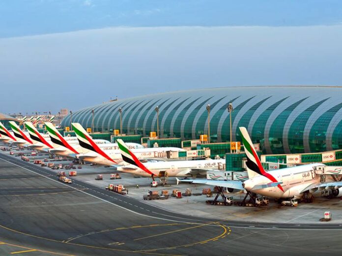 Dubai International Airport bustling with travelers during peak season